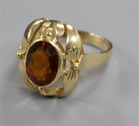 A 585 yellow metal and oval citrine dress ring, size N.